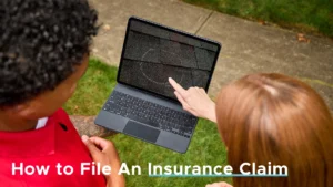Homeowner and roofing professional reviewing roof damage on a tablet while discussing an insurance claim.